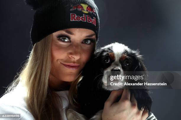Lindsey Vonn of USA poses with her dog Lucy after a press conference at Hotel Reine Victoria ahead of the FIS Alpine World Ski Championships on...