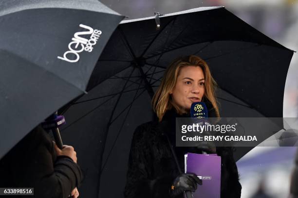 French journalist Anne-Laure Bonnet speaks on a microphone prior to the the French L1 football match between Toulouse and Angers on february 5, 2017...