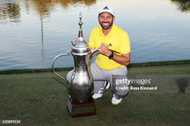 Sergio Garcia of Spain poses with the trophy following his victory during the final round of the Omega Dubai Desert Classic at Emirates Golf Club on...