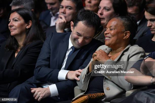 Benoit Hamon and Former French Minister of Justice Christiane Taubira react as members of the Socialist Party speak during his convention to become...