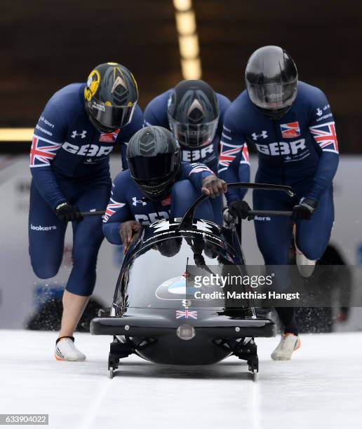 Lamin Deen, Ben Simons, John Baines and Andrew Matthews of Great Britain compete during the first run of the 4-man Bobsleigh BMW IBSF World Cup at...