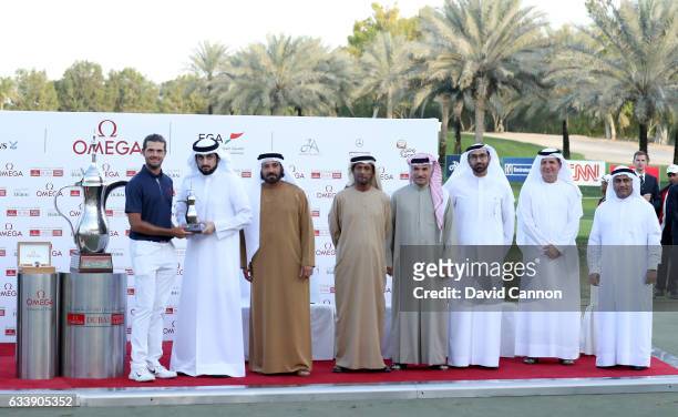 Curtis Luck of Australia is presented with his leading amateur trophy by His Highness Shaikh Ahmed Bin Mohammed Bin Rashid Al Maktoum the President...