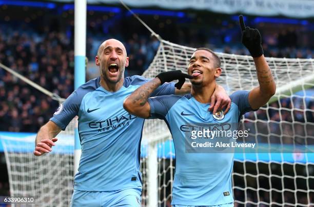 Gabriel Jesus of Manchester City celebrates scoring his sides second goal with Pablo Zabaleta during the Premier League match between Manchester City...