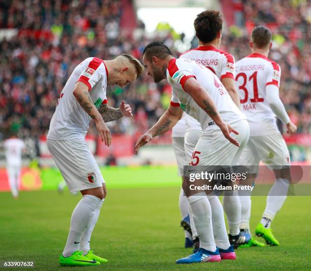 Jonathan Schmid of Augsburg celebrates scoring his goal with Ral Bobadilla during the Bundesliga match between FC Augsburg and Werder Bremen at WWK...