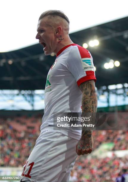Jonathan Schmid of Augsburg celebrates scoring his goal during the Bundesliga match between FC Augsburg and Werder Bremen at WWK Arena on February 5,...