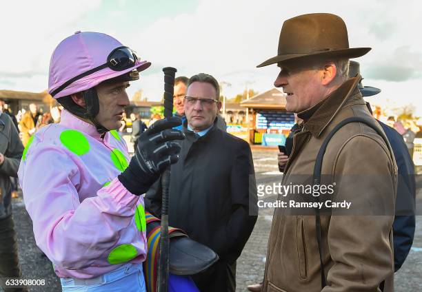Naas , Ireland - 5 February 2017; Jockey Ruby Walsh, left, in conversation with trainer Willie Mullins after sending out Douvan to win the...