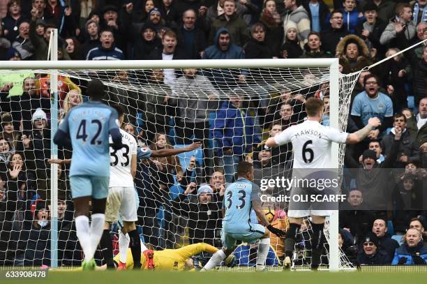 Manchester City's Brazilian striker Gabriel Jesus scores their late winning goal during the English Premier League football match between Manchester...