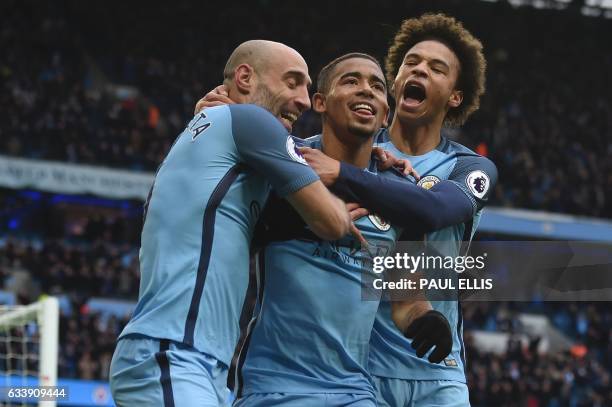 Manchester City's Brazilian striker Gabriel Jesus celebrates with Manchester City's Argentinian defender Pablo Zabaleta and Manchester City's German...