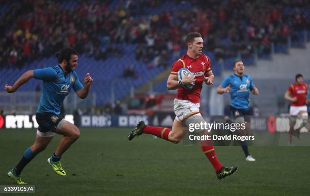 George North of Wales outpaces Luke McLean of Italy to score his team's third try during the RBS Six Nations match between Italy and Wales at the...