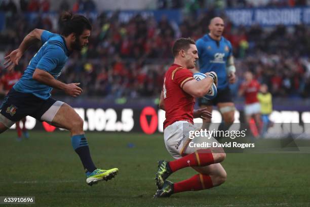 George North of Wales outpaces Luke McLean of Italy to score his team's third try during the RBS Six Nations match between Italy and Wales at the...