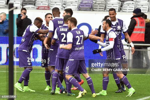 Toulouse's players react after their captain Martin Braithwaite scored a goal during the French L1 football match between Toulouse and Angers, on...