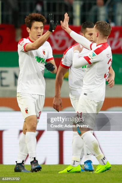 Koo Ja-Cheol of Augsburg celebrates scoring the third goal during the Bundesliga match between FC Augsburg and Werder Bremen at WWK Arena on February...