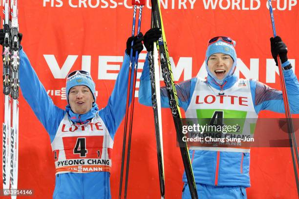 First Place Andrey Parfenov and Gleb Retivykh of Russia celebrate during a flower ceremony in the Men 6x1.5km Team Sprint Final during the FIS Nordic...