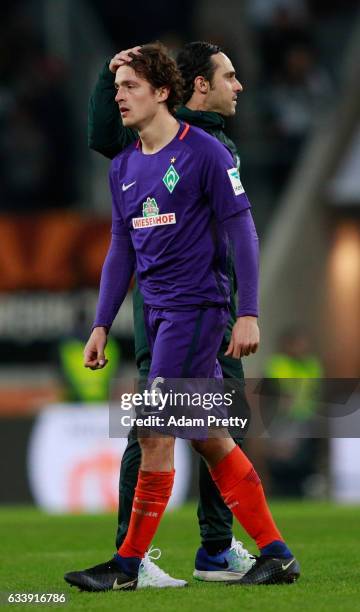 Thomas Delaney of Bremen is consoled by Alexander Nouri, head coach of Bremen after the Bundesliga match between FC Augsburg and Werder Bremen at WWK...