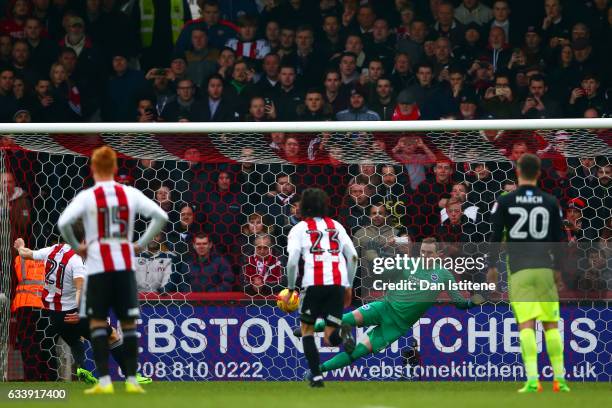 David Stockdale of Brighton & Hove Albion saves a penalty from Lasse Vibe of Brentford during the Sky Bet Championship match between Brentford and...