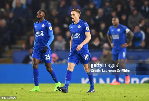 Wilfred Ndidi and Andy King of Leicester City look dejected as Juan Mata of Manchester United scores their third goal during the Premier League match...