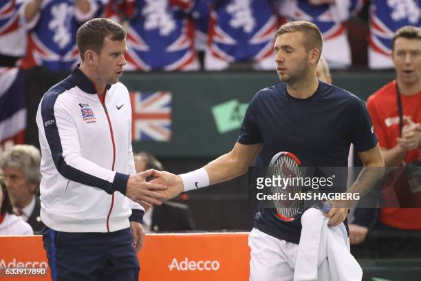 Great Britain's coach Leon Smith wishes Daniel Evans good luck against Vasek Pospisil of Canada during the third day of Davis Cup first round between...