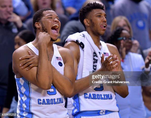 Kennedy Meeks and Tony Bradley of the North Carolina Tar Heels cheer on their teammates during the game against the Notre Dame Fighting Irish at the...