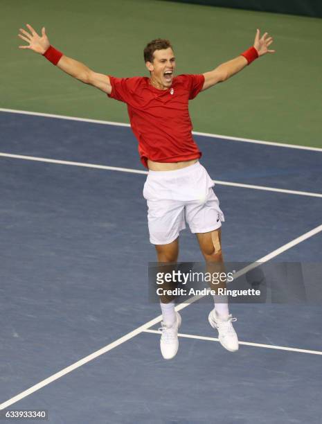 Vasek Pospisil of Canada jumps as he celebrates his win over Dan Evans of Great Britain in their singles match on day three of the Davis Cup World...