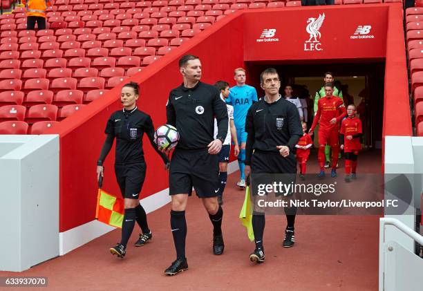 Referee Andrew Miller and assistants Rebecca Welch and Paul Brown lead the captains Harry Wilson of Liverpool and Filip Lesniak of Tottenham Hotspur...