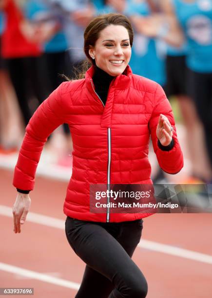 Catherine, Duchess of Cambridge takes part in a running race against Prince William, Duke of Cambridge and Prince Harry as they join a Team Heads...