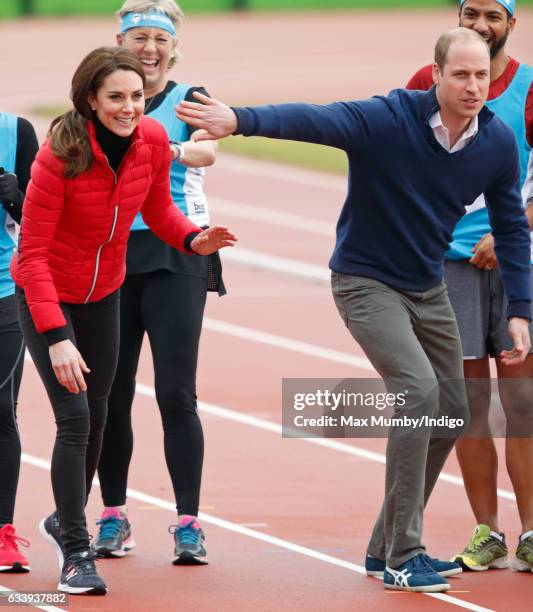 Catherine, Duchess of Cambridge and Prince William, Duke of Cambridge take part in a running race against Prince Harry as they join a Team Heads...