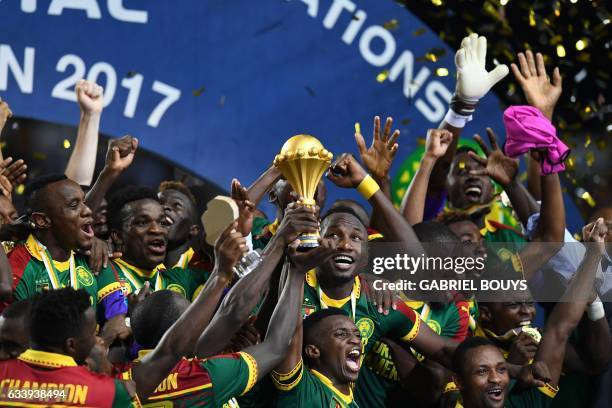 The Cameroon football team celebrate with the winner's trophy after beating Egypt 2-1 to win the 2017 Africa Cup of Nations final football match...