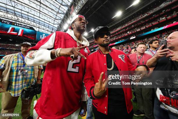 Recording artists 2 Chainz and Usher pose prior to Super Bowl 51 between the New England Patriots and the Atlanta Falcons at NRG Stadium on February...