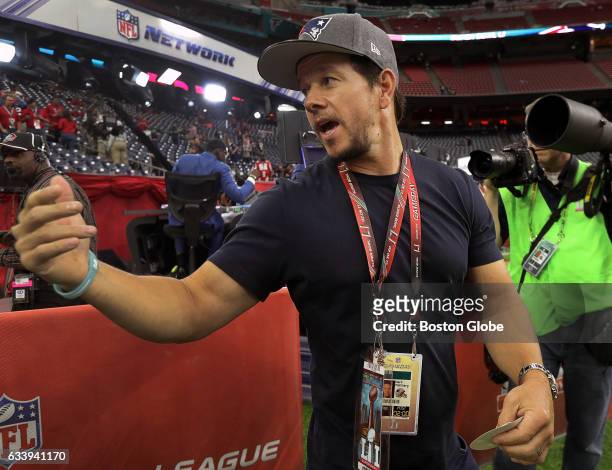 Movie star and New England Patriots fan Mark Wahlberg on the field as he prepares for a television appearance before today's game. The Atlanta...