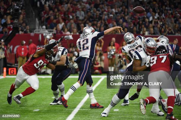 Tom Brady of the Patriots passes during Super Bowl LI between the New England Patriots and the Atlanta Falcons at NGR Stadium in Houston, Texas, on...