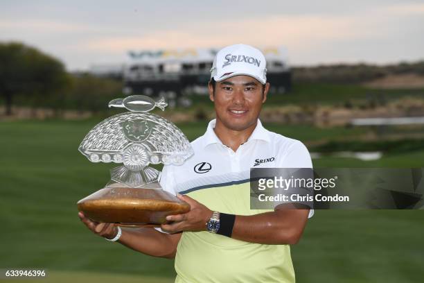 Hideki Matsuyama of Japan holds the tournament trophy after winning the Waste Management Phoenix Open, at TPC Scottsdale on February 5, 2017 in...