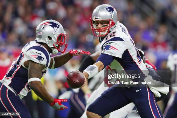 Dion Lewis takes the handoff from Tom Brady of the New England Patriots during the second quarter against the Atlanta Falcons during Super Bowl 51 at...