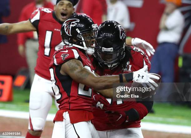Terron Ward of the Atlanta Falcons celebrates with Courtney Upshaw after scoring a touchdown against the New England Patriots during the second...