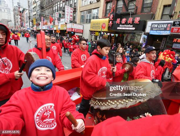 Students of P.S. 130 The Desoto School perform with drums to celebrate the Year of the Rooster at the Lunar New Year Firecrackers Parade Festival and...