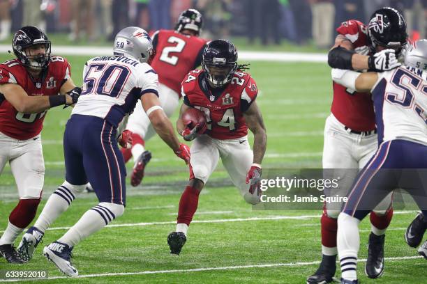 Devonta Freeman of the Atlanta Falcons runs past Rob Ninkovich of the New England Patriots during Super Bowl 51 at NRG Stadium on February 5, 2017 in...
