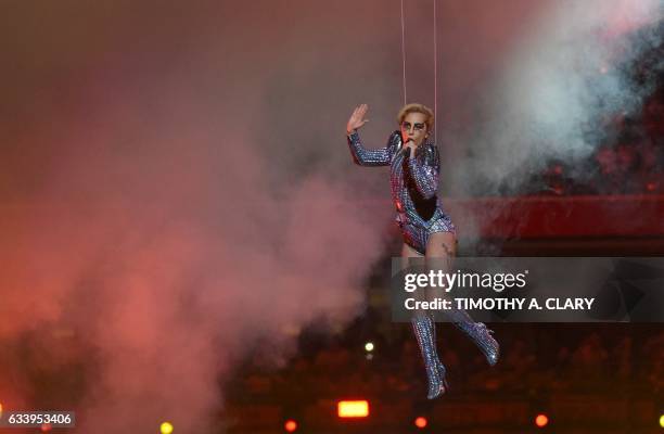 Singer Lady Gaga performs during the halftime show of Super Bowl LI at NGR Stadium in Houston, Texas, on February 5, 2017. / AFP PHOTO / Timothy A....