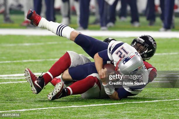 Tom Brady of the New England Patriots is sacked by Grady Jarrett of the Atlanta Falcons in the fourth quarter during Super Bowl 51 at NRG Stadium on...