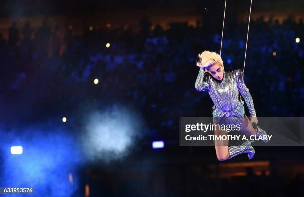 Singer Lady Gaga performs during the halftime show of Super Bowl LI at NGR Stadium in Houston, Texas, on February 5, 2017. / AFP PHOTO / Timothy A....