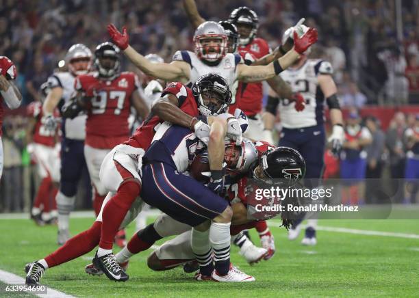 Danny Amendola of the New England Patriots scores a two point conversion late in the fourth quarter against Jalen Collins the Atlanta Falcons during...