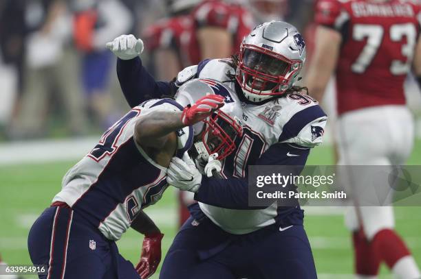 Dont'a Hightower of the New England Patriots celebrates with Malcom Brown after forcing a fumble from Matt Ryan of the Atlanta Falcons during the...