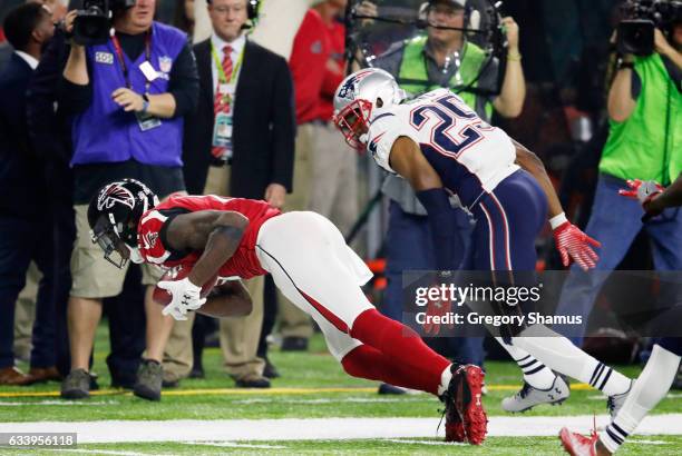 Julio Jones of the Atlanta Falcons makes a catch over Eric Rowe of the New England Patriots in the fourth quarter during Super Bowl 51 at NRG Stadium...