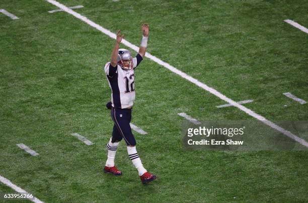 Tom Brady of the New England Patriots celebrates after James White scored a touchdown during over time of Super Bowl 51 at NRG Stadium on February 5,...