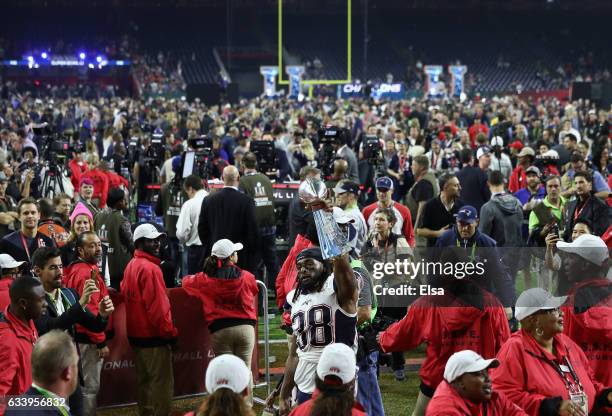 Brandon Bolden of the New England Patriots raises the Vince Lombardi trophy after the Patriots defeat the Atlanta Falcons 34-28 in Super Bowl 51 at...