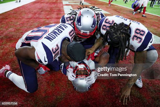 James White of the New England Patriots celebrates with teammates after defeating the Atlanta Falcons 34-28 in overtime to win Super Bowl 51 at NRG...