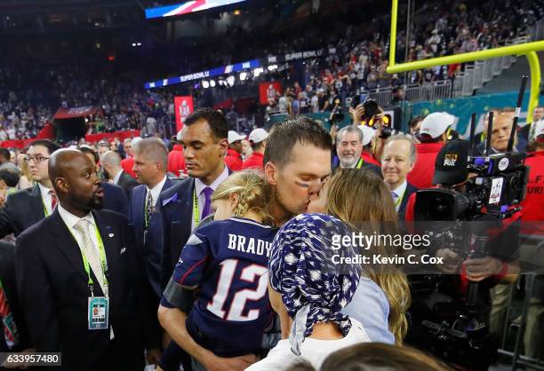 Tom Brady of the New England Patriots celebrates with wife Gisele Bundchen, daughter Vivian Brady and mother Galynn Brady after defeating the Atlanta...