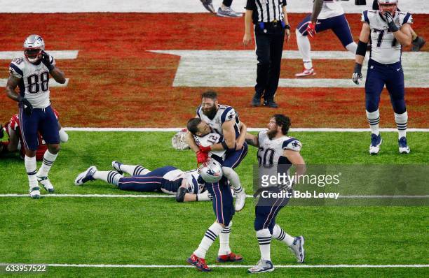 Tom Brady of the New England Patriots reacts after defeating the Atlanta Falcons 34-28 in overtime during Super Bowl 51 at NRG Stadium on February 5,...
