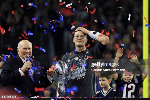 Tom Brady of the New England Patriots holds the Vince Lombardi Trophy after defeating the Atlanta Falcons 34-28 in overtime during Super Bowl 51 at...