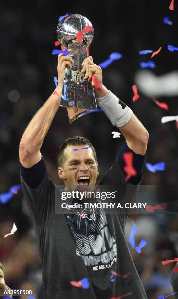 Tom Brady of the New England Patriots holds the Lombardi Trophy after defeating the Atlanta Falcons during Super Bowl 51 at NRG Stadium on February...