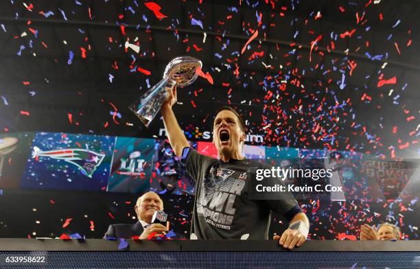 Tom Brady of the New England Patriots raises the Vince Lombardi Trophy after defeating the Atlanta Falcons during Super Bowl 51 at NRG Stadium on...