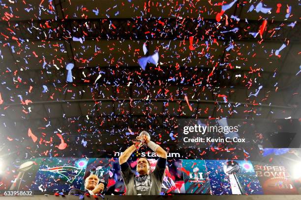 Tom Brady of the New England Patriots raises the Vince Lombardi Trophy after defeating the Atlanta Falcons during Super Bowl 51 at NRG Stadium on...